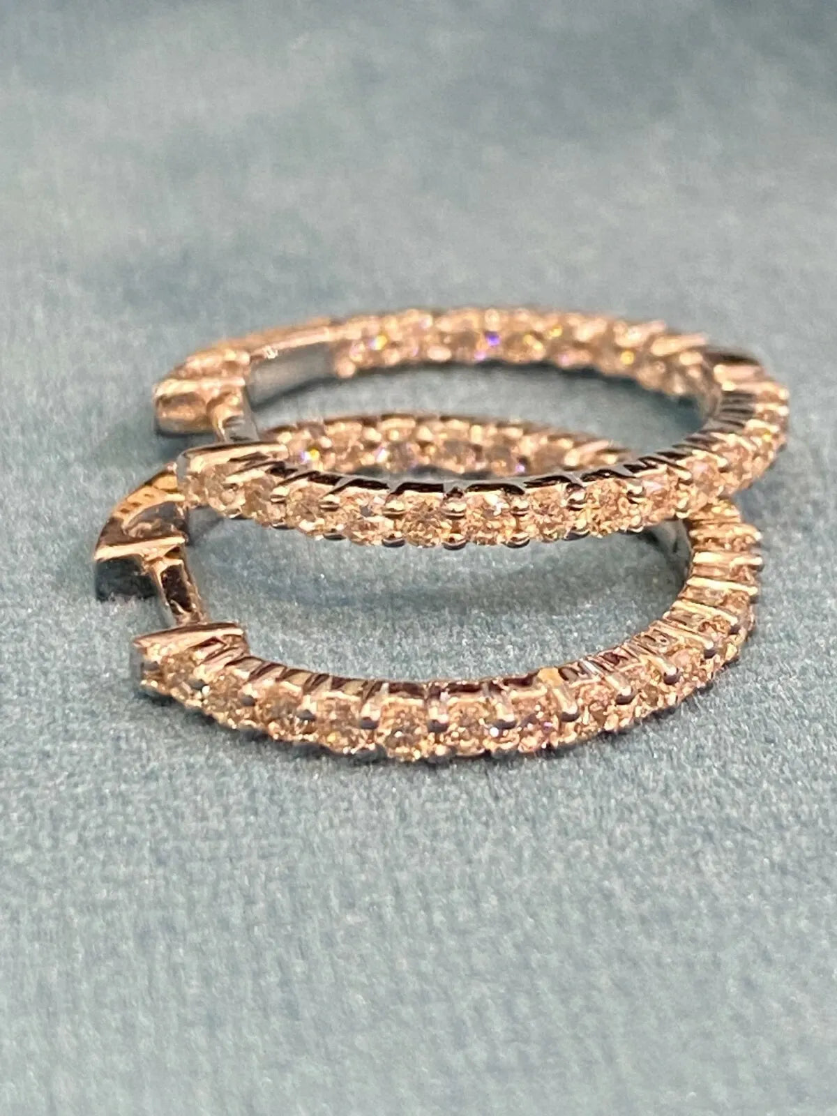 18K gold hoop earrings, set with 0.75 carats total weight of round brilliant-cut "inside-out" diamonds