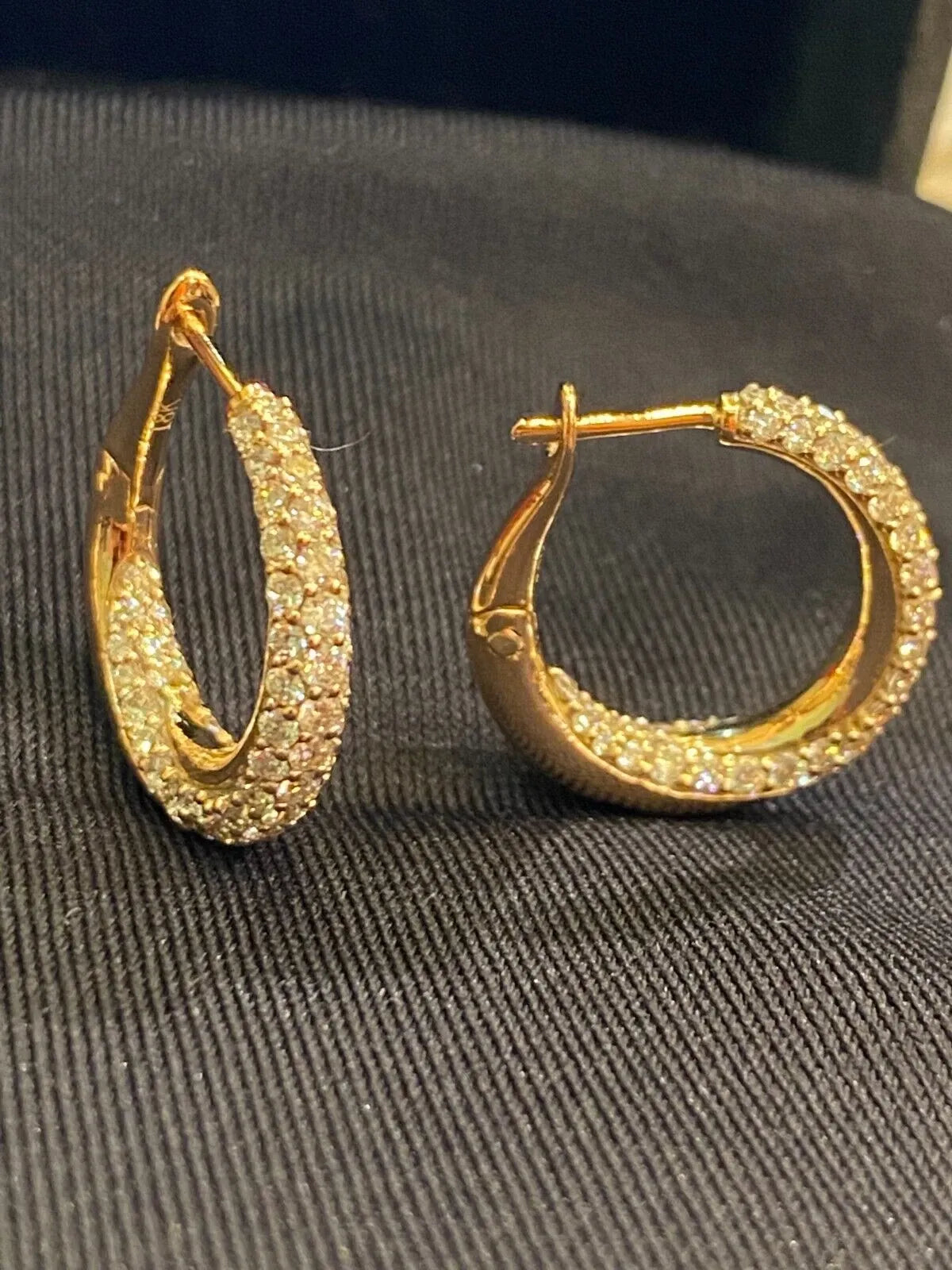 18-carat gold hoop earrings, set with brilliant-cut round “inside-out” diamonds weighing a total of 1.80 carats