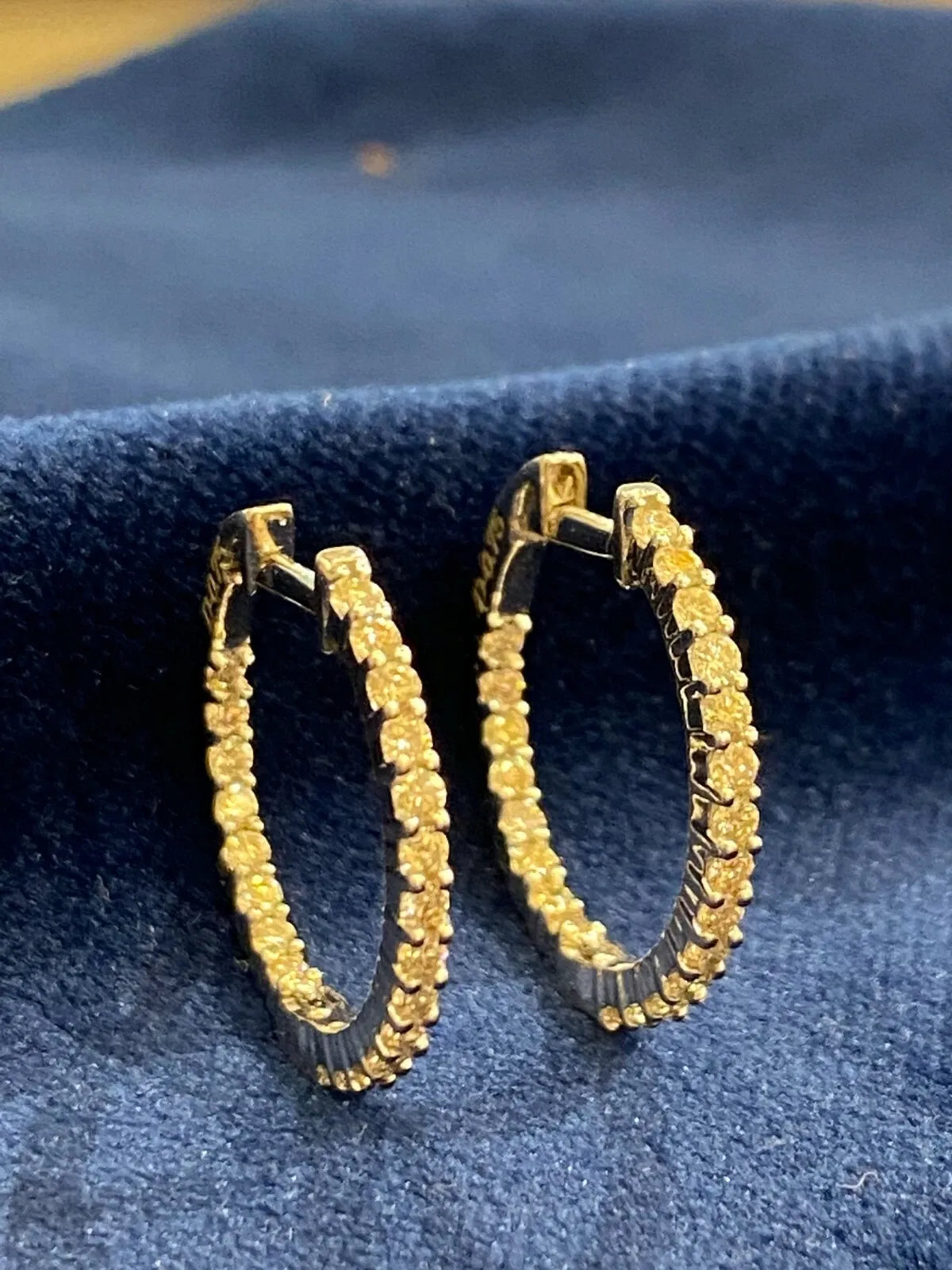 18K gold hoop earrings, set with 0.75 carats total weight of round brilliant-cut "inside-out" diamonds