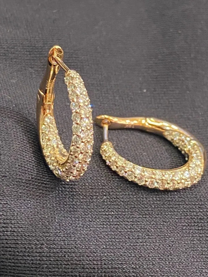 18-carat gold hoop earrings, set with brilliant-cut round “inside-out” diamonds weighing a total of 1.80 carats