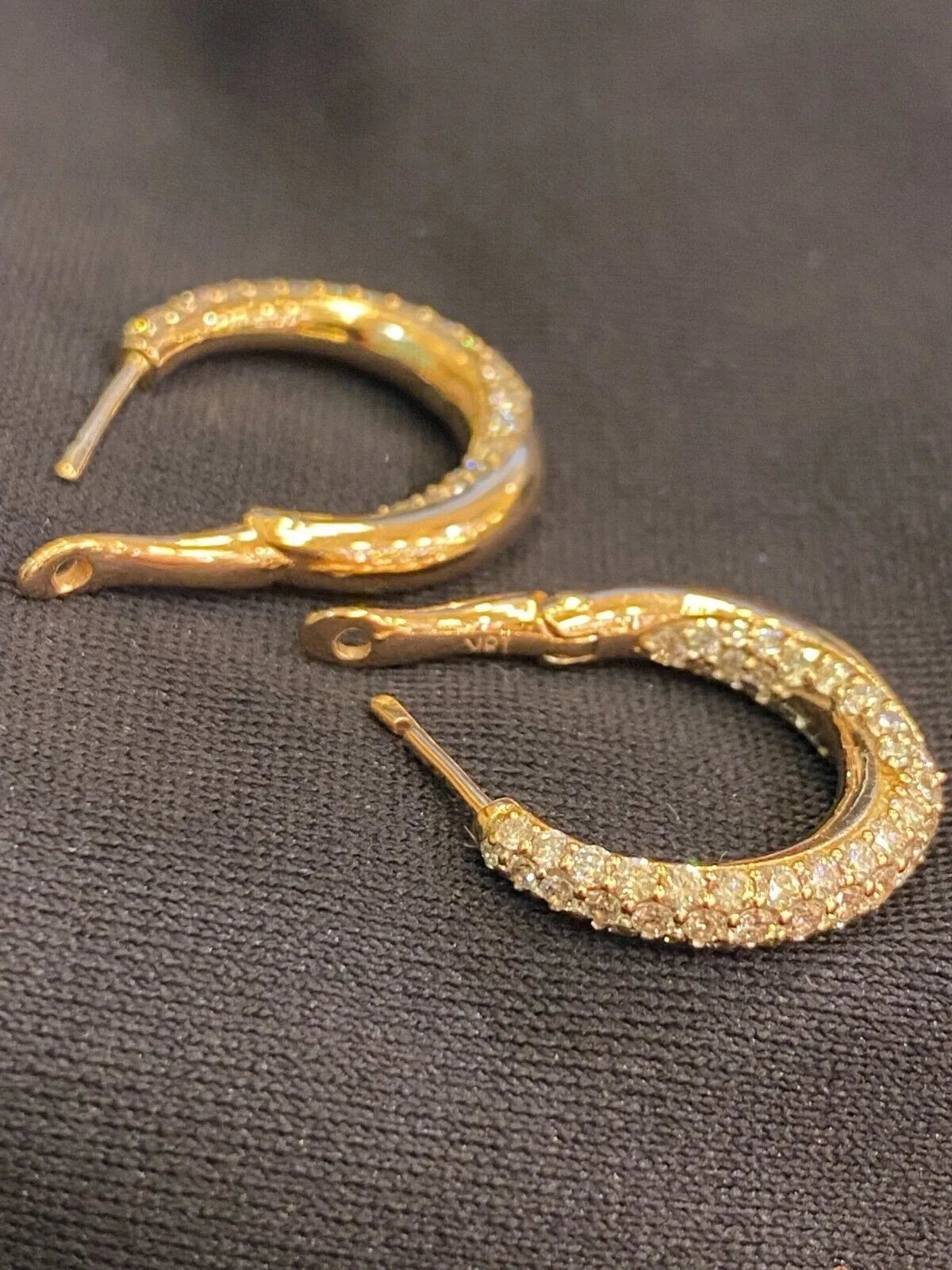 18-carat gold hoop earrings, set with brilliant-cut round “inside-out” diamonds weighing a total of 1.80 carats