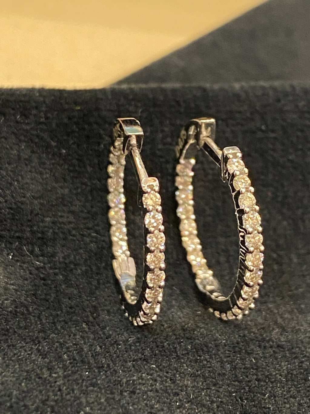18K gold hoop earrings, set with 0.75 carats total weight of round brilliant-cut "inside-out" diamonds