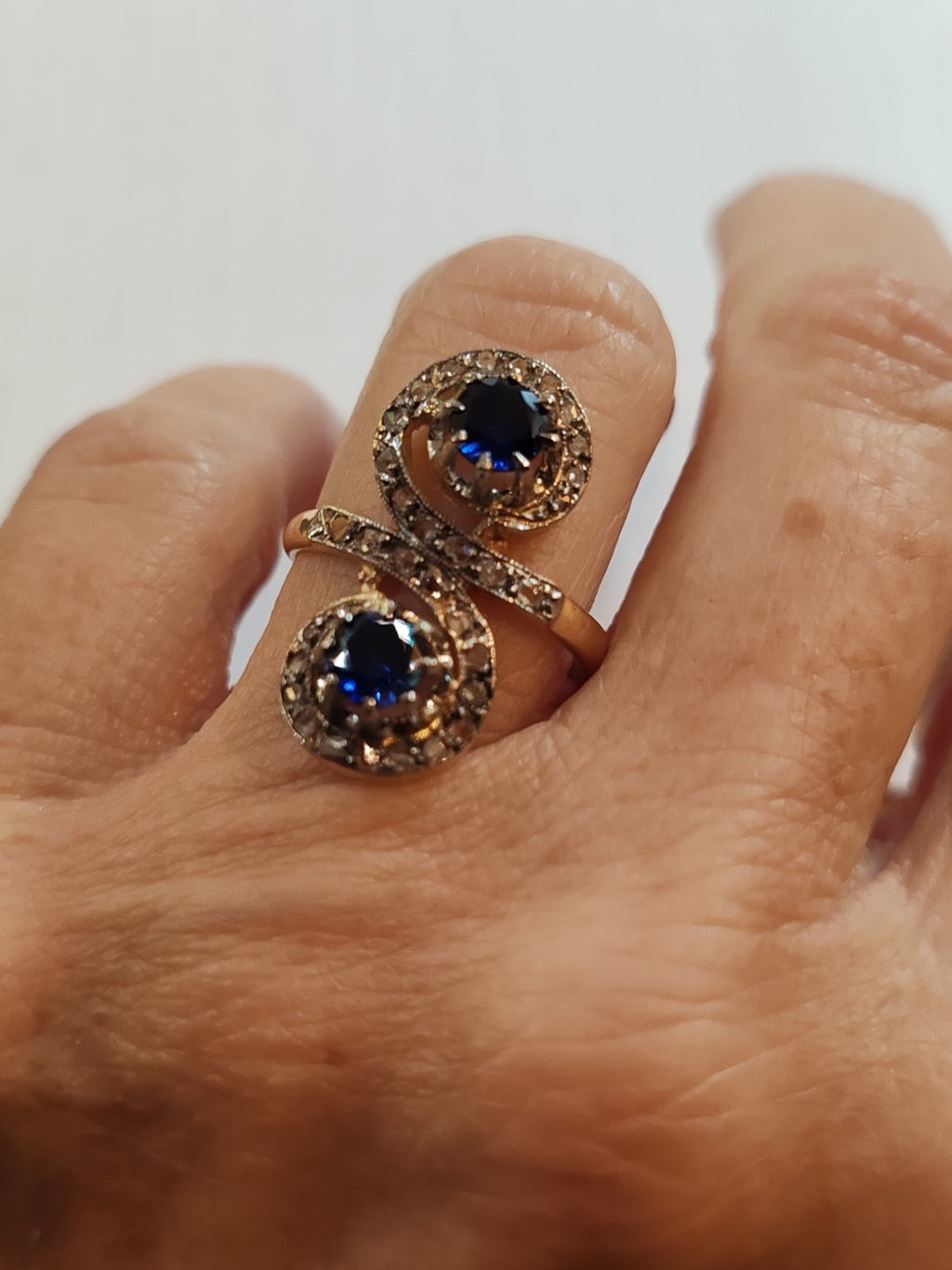 Antique 18K gold toi et moi ring with sapphires and old-cut diamonds
