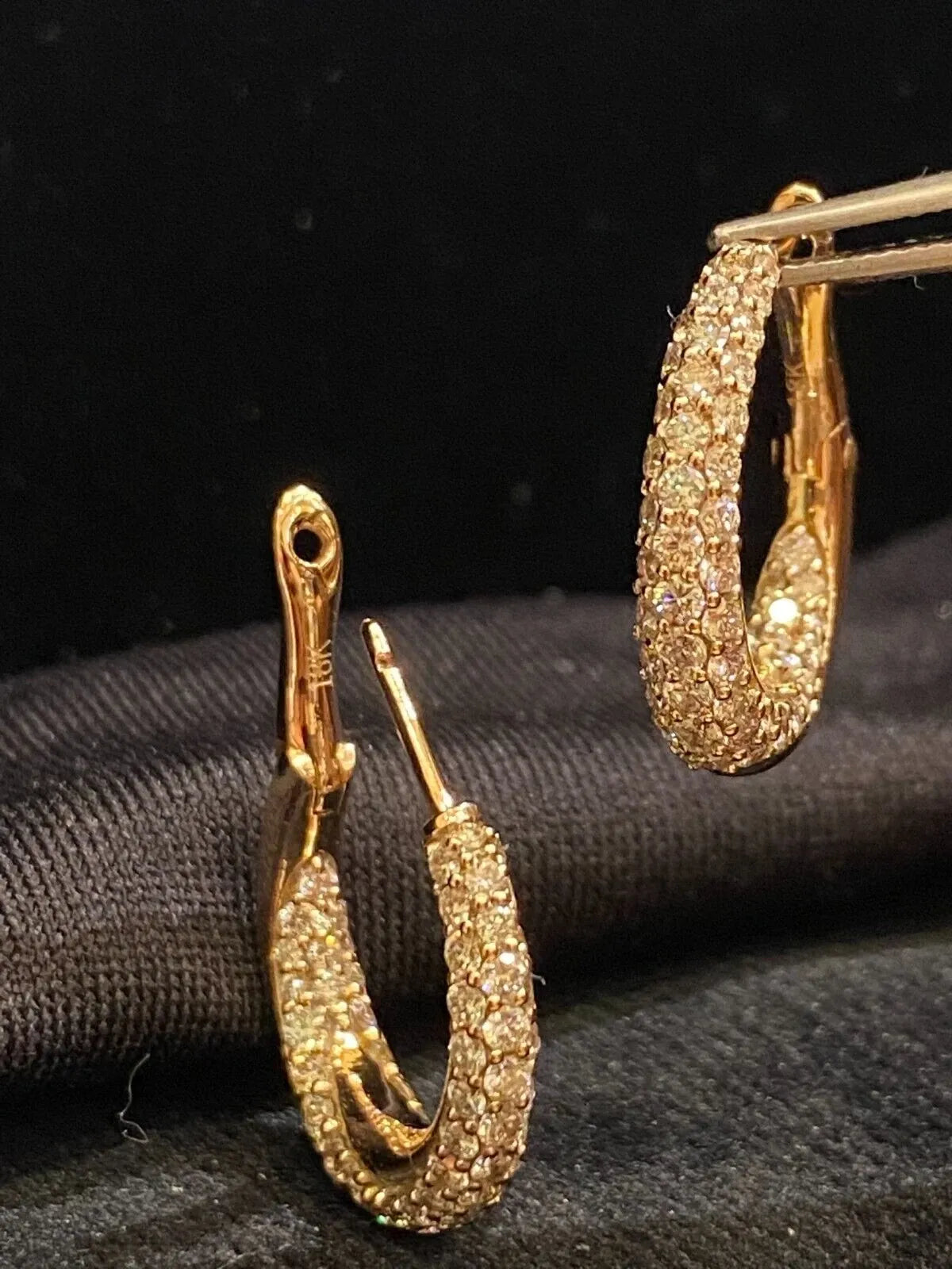 18-carat gold hoop earrings, set with brilliant-cut round “inside-out” diamonds weighing a total of 1.80 carats