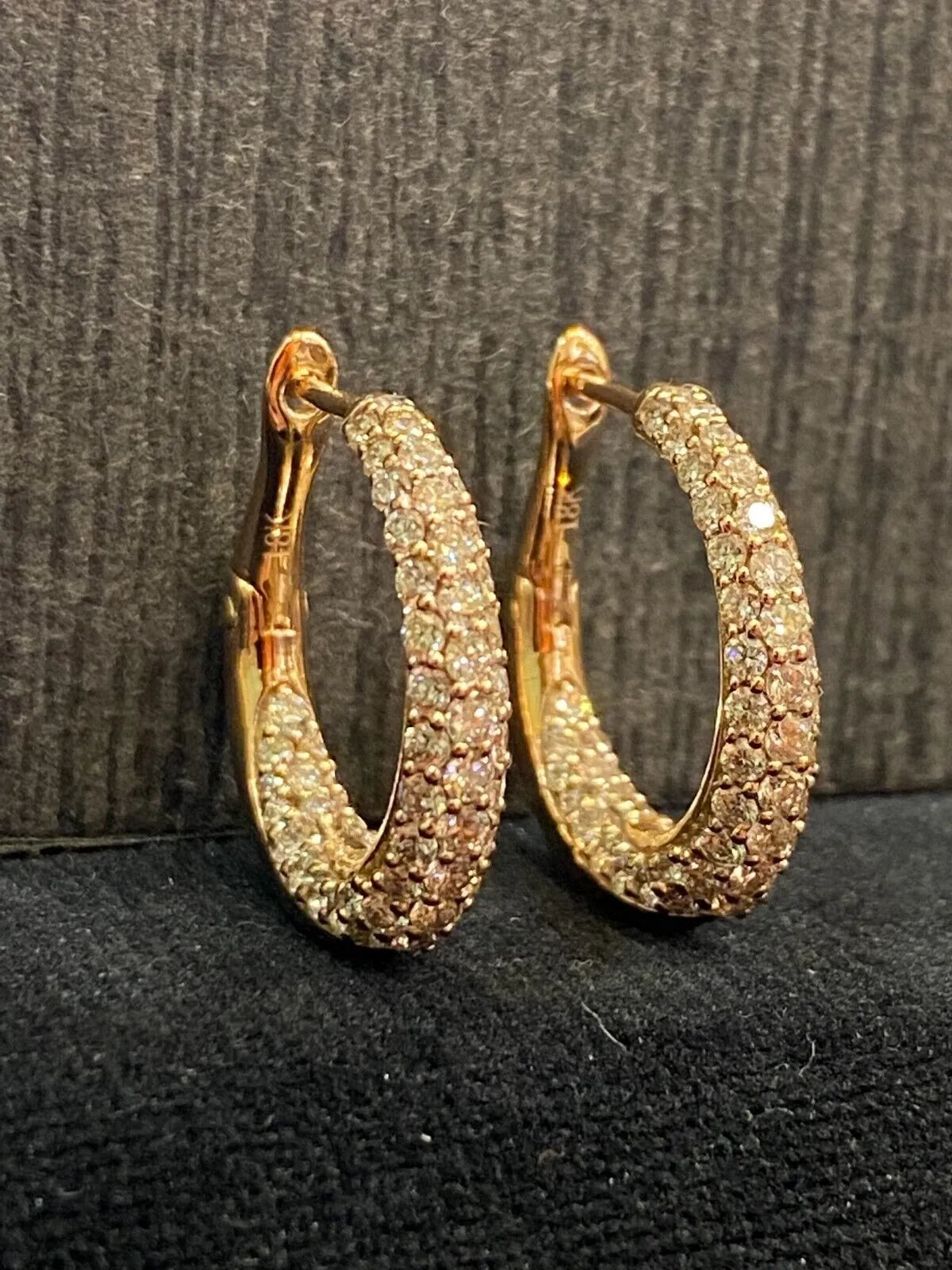 18-carat gold hoop earrings, set with brilliant-cut round “inside-out” diamonds weighing a total of 1.80 carats