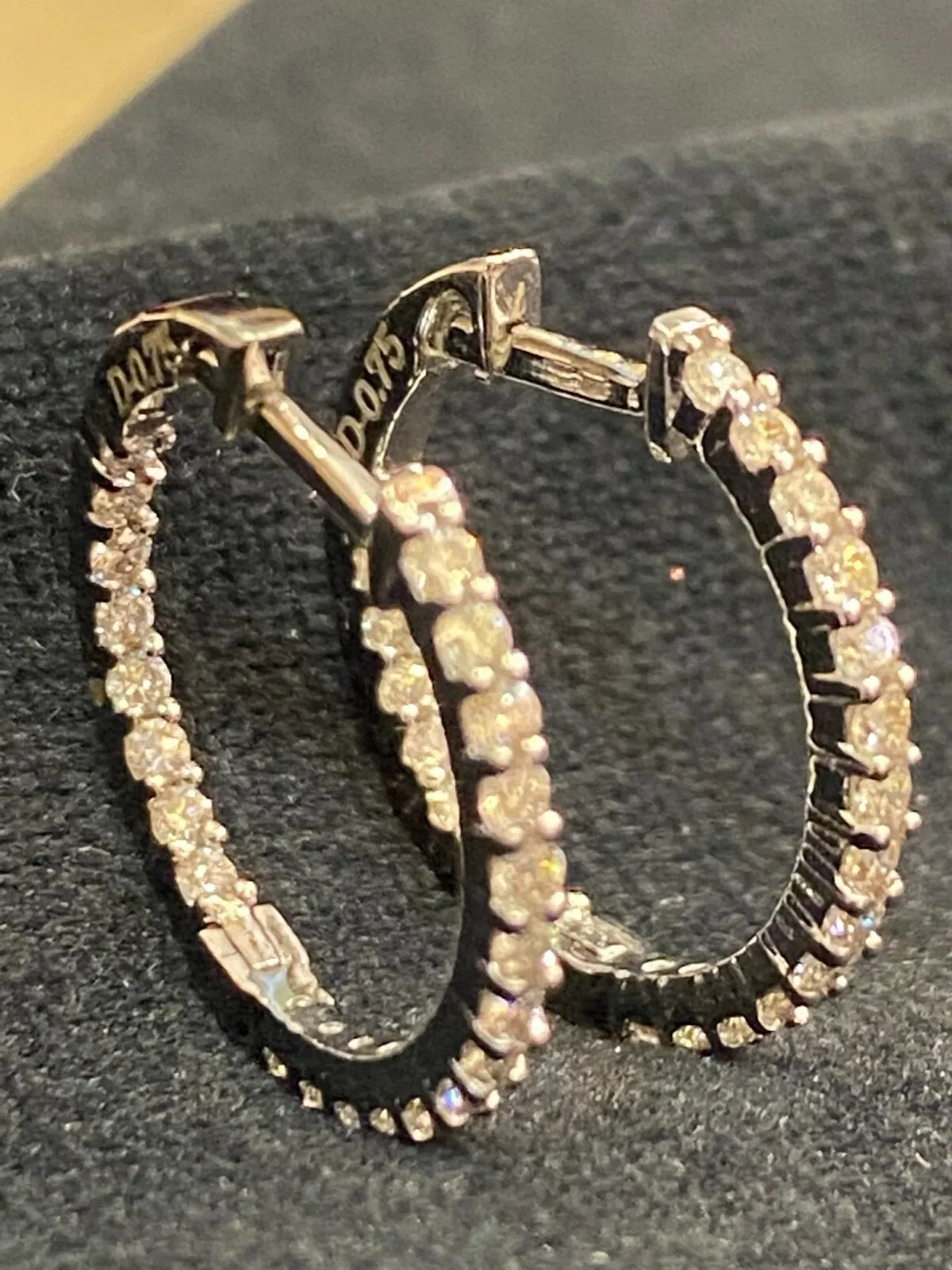 18K gold hoop earrings, set with 0.75 carats total weight of round brilliant-cut "inside-out" diamonds