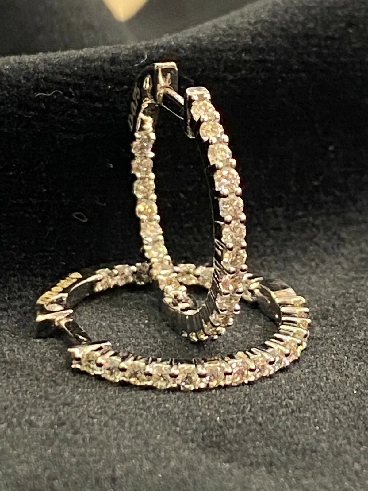 18K gold hoop earrings, set with 0.75 carats total weight of round brilliant-cut "inside-out" diamonds