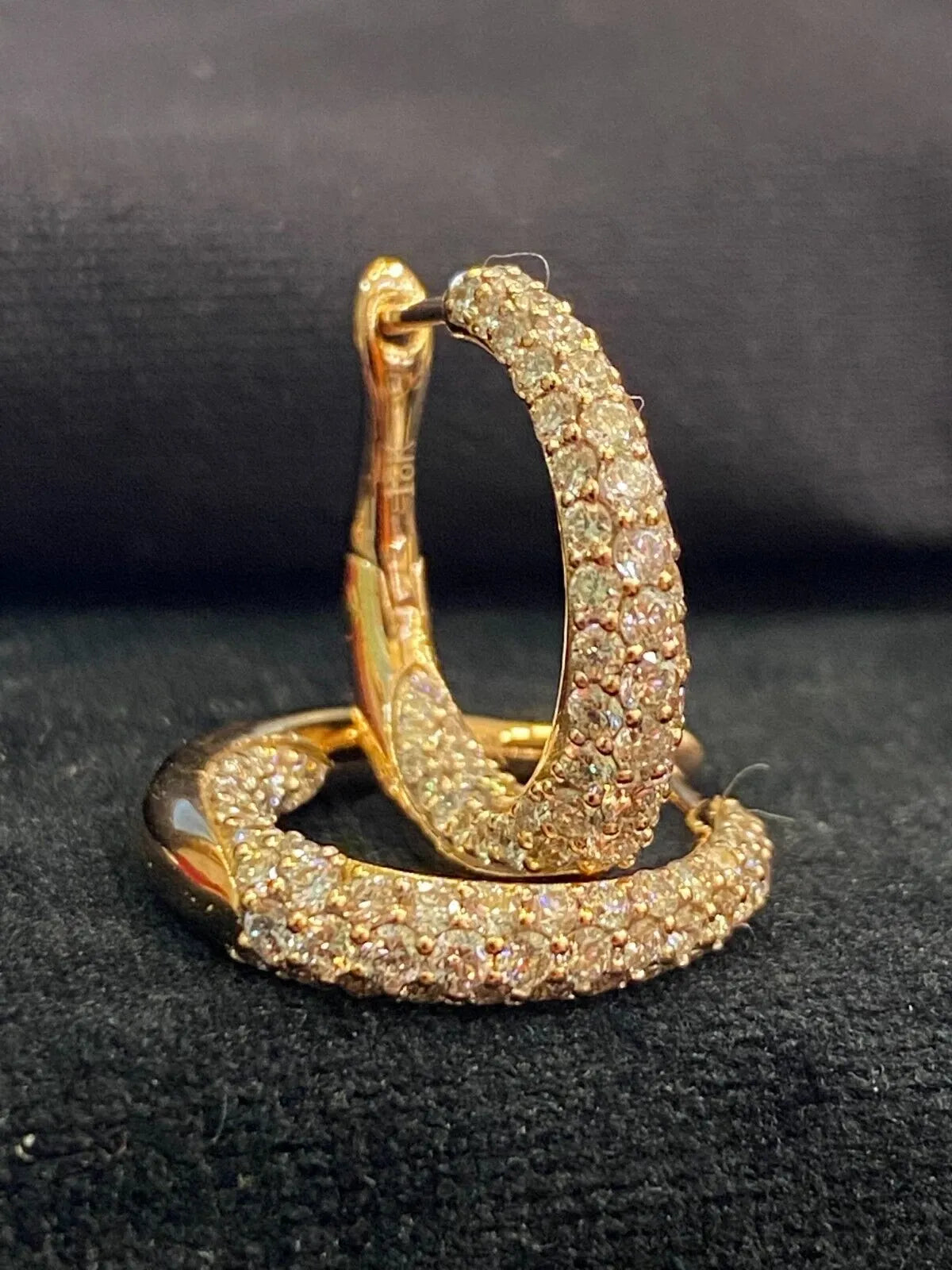 18-carat gold hoop earrings, set with brilliant-cut round “inside-out” diamonds weighing a total of 1.80 carats