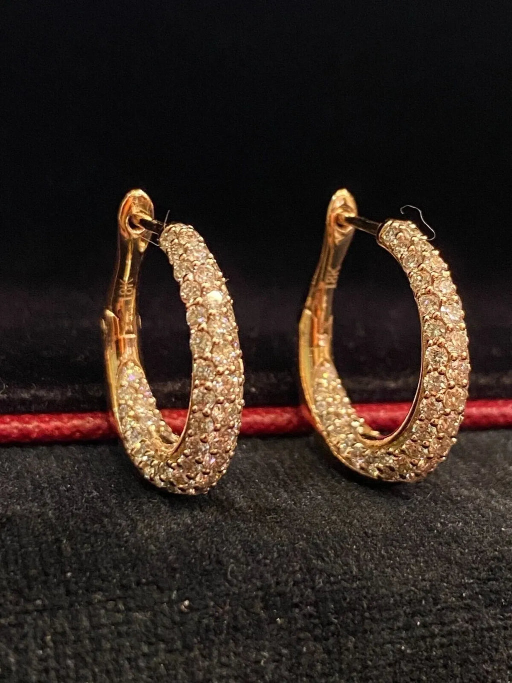 18-carat gold hoop earrings, set with brilliant-cut round “inside-out” diamonds weighing a total of 1.80 carats
